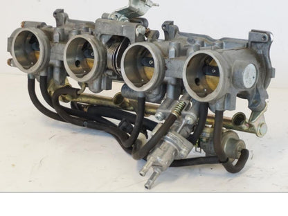 Vänster sida på Spjällhus från en Honda CBR 900 RR -2001 motorcykel.