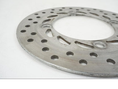 Vänster sida på Bromsskiva från en Honda CBR 125 R -2006 motorcykel.