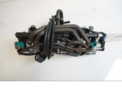 Vänster sida på Spjällhus från en Honda CBR 1000 RR -2009 motorcykel.