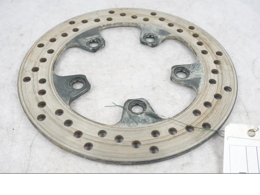 Framsidan på Bromsskiva från en Suzuki SV 650 -2004 motorcykel.