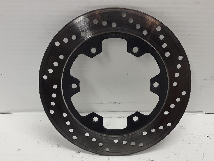 Framsidan på Bromsskiva från en Ducati 750 SS -2000 motorcykel.