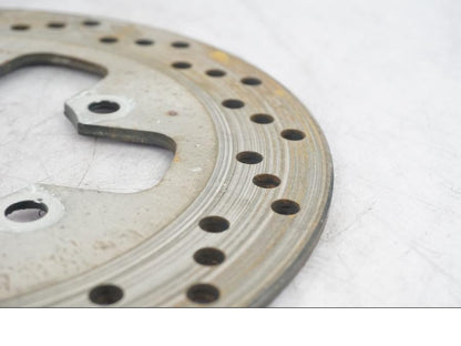 Vänster sida på Bromsskiva från en Suzuki SV 650 -1999 motorcykel.