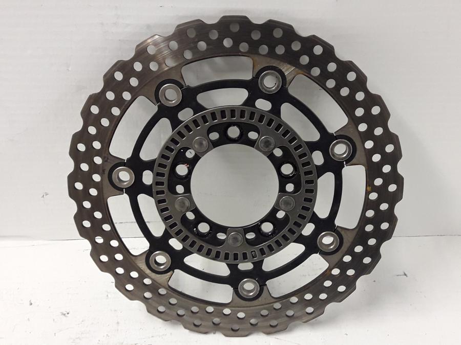 Framsidan på Bromsskiva från en Kawasaki ER-6N -2015 motorcykel.