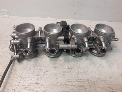 Framsidan på Spjällhus från en Kawasaki ZX-6R -2008 motorcykel.