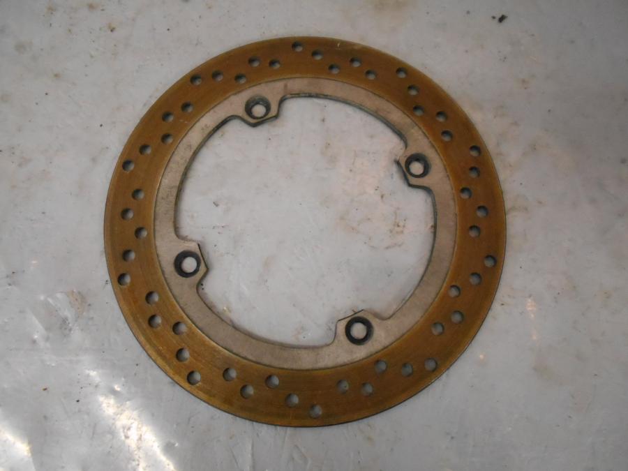 Framsidan på Bromsskiva från en Suzuki DL 650 -2013 motorcykel.