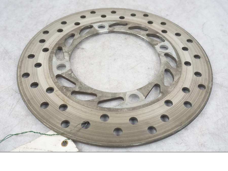 Höger sida på Bromsskiva från en Honda CBR 125 R -2004 motorcykel.