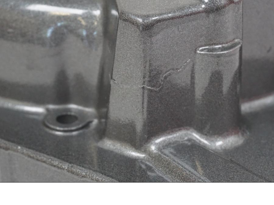 Snett nerifrån på Generatorkåpa från en Yamaha TT 600 S -1995 motorcykel.