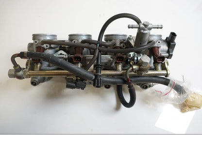 Vänster sida på Spjällhus från en Honda CBR 1000 RR -2006 motorcykel.