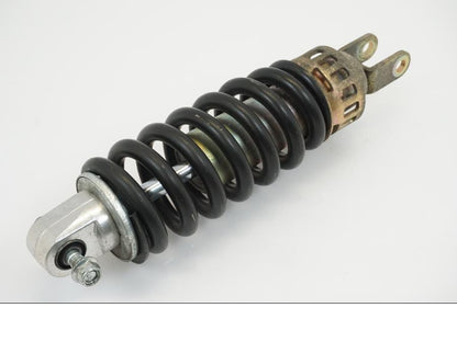 Vänster sida på <p>Stötdämpare från Suzuki GSX-R 600 Corona 2000.</p>

<p>Okej skick, justerbar. C/C mått: ca 300mm.</p> motorcykel.