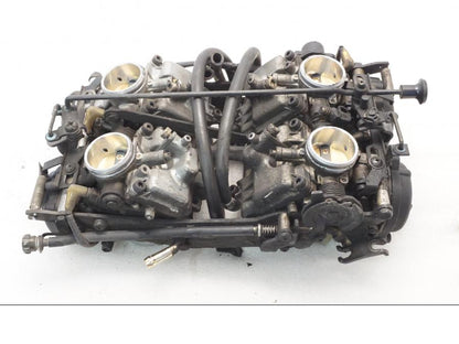 Baksidan på Förgasare från en Yamaha XVZ 13TD -1999 motorcykel.