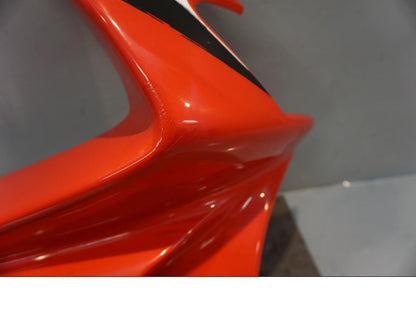 Vänster sida på Toppkåpa från en Honda NSR 125 -1998 motorcykel.