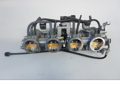 Baksidan på Spjällhus från en Kawasaki Versys 1000 -2015 motorcykel.