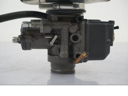 Vänster sida på Förgasare från en Aprilia RS 125 -2000 motorcykel.