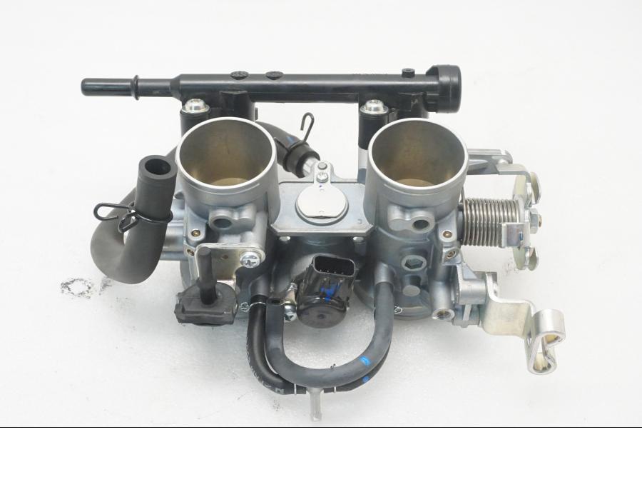 Framsidan på Spjällhus från en Kawasaki Z 400 -2020 motorcykel.