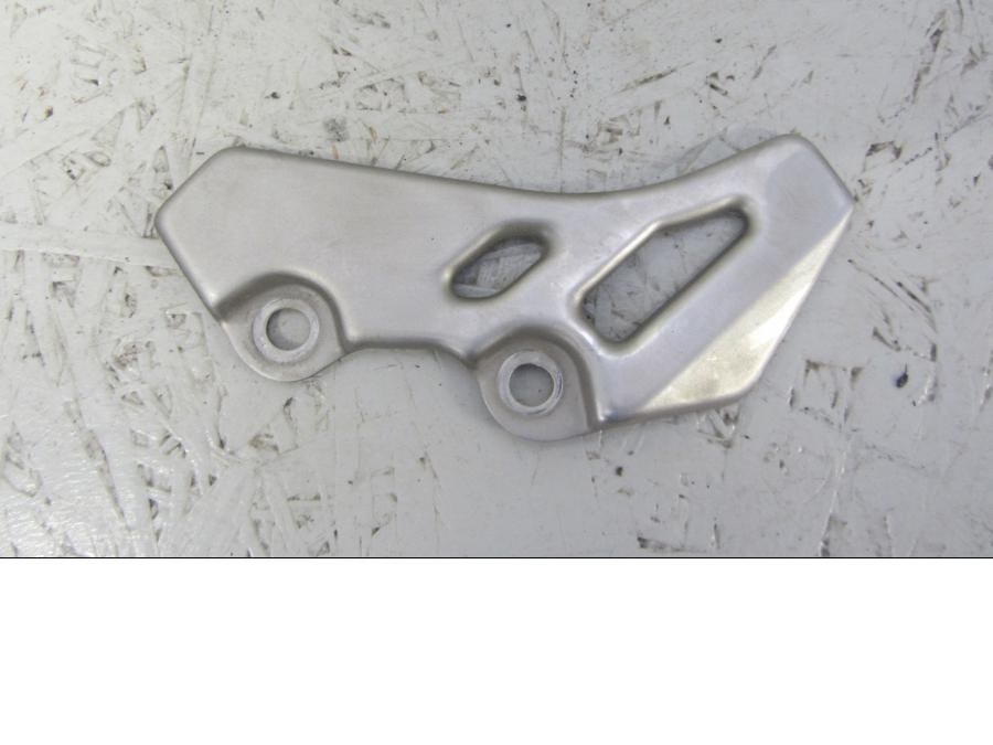 Framsidan på Fotpinnehälskydd från en Yamaha XT660Z Tenere -2009 motorcykel.