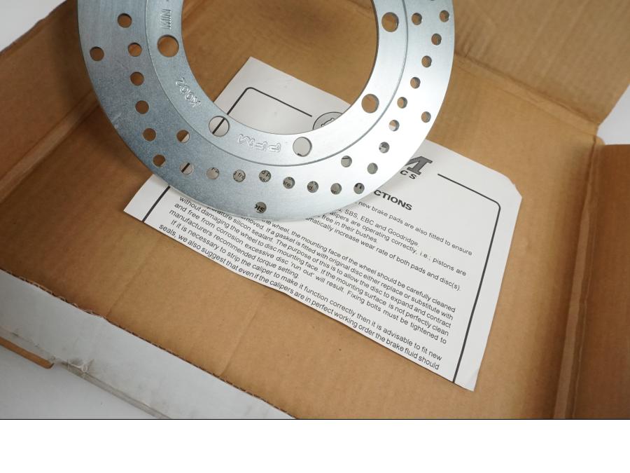 Höger sida på Bromsskiva från en Kawasaki KMX 125 -2000 motorcykel.