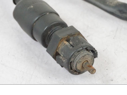 Baksidan på Bromsljuskontakt från en Kawasaki KL 650A -1987 motorcykel.