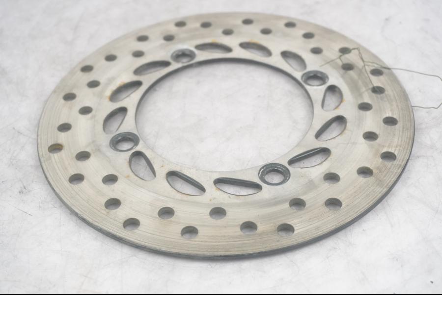 Framsidan på Bromsskiva från en Honda CBR 125 R -2011 motorcykel.