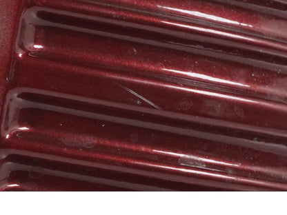 Vänster sida på Oljetank från en H-D Softail FXCW Rocker -2008 motorcykel.