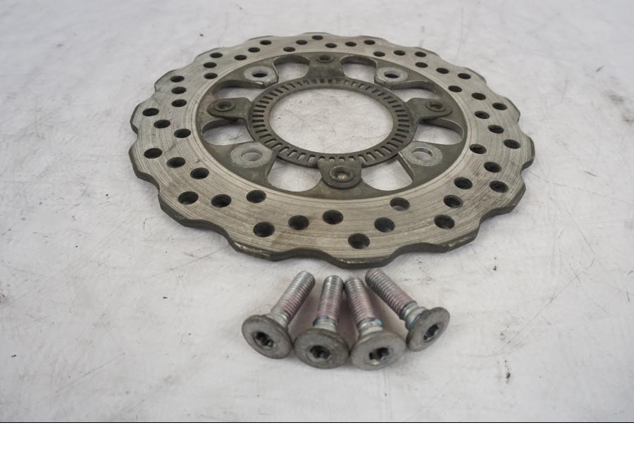 Framsidan på Bromsskiva från en Kawasaki ER-6F -2010 motorcykel.