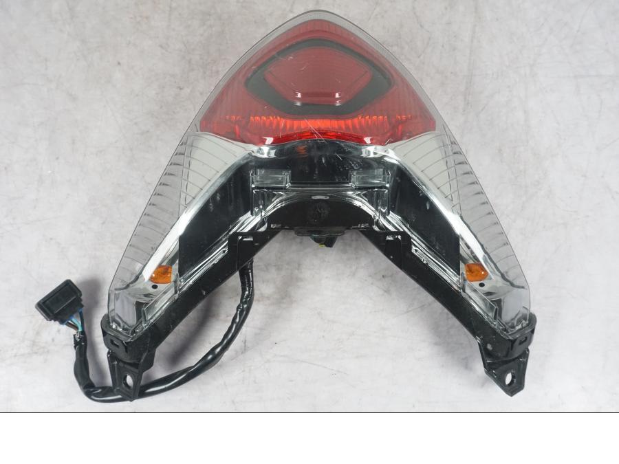 Framsidan på Baklampa från en Honda ANC 125 -2022 scooter.