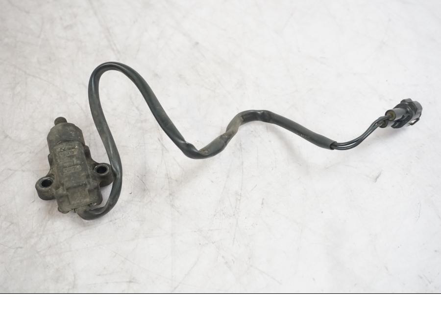 Vänster sida på Sidostödsbrytare från en Triumph Tiger -2009 motorcykel.