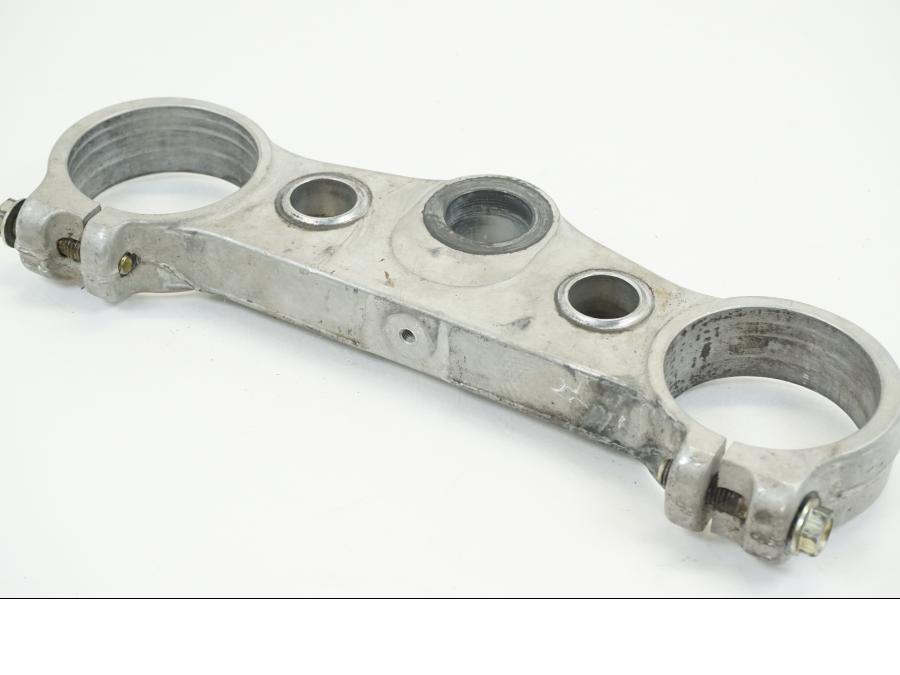 Baksidan på Gaffelkrona från en Husqvarna TE 310 -2009 motorcykel.