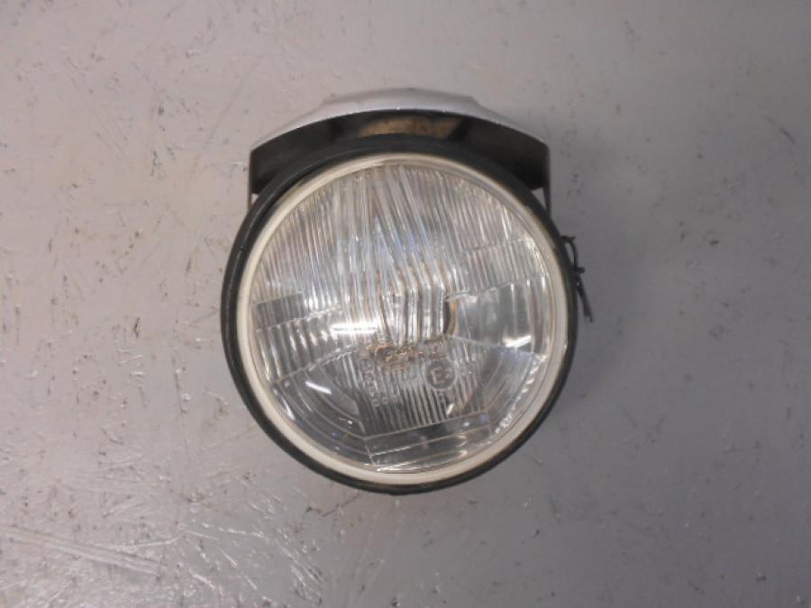 Framsidan på Strålkastare från en H-D FXD Dyna Glide -1992 motorcykel.