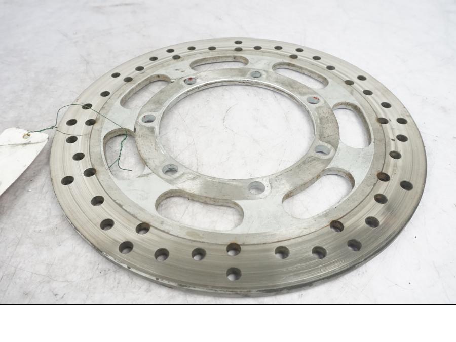 Framsidan på Bromsskiva från en Kawasaki VN 1600 Mean Streak -2004 motorcykel.