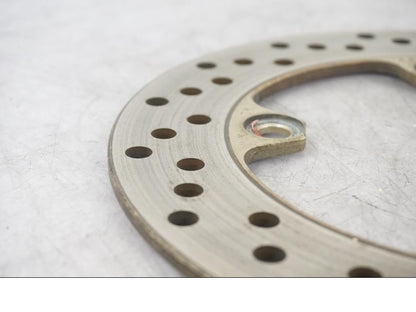 Baksidan på Bromsskiva från en Kawasaki ZX-6R -1999 motorcykel.