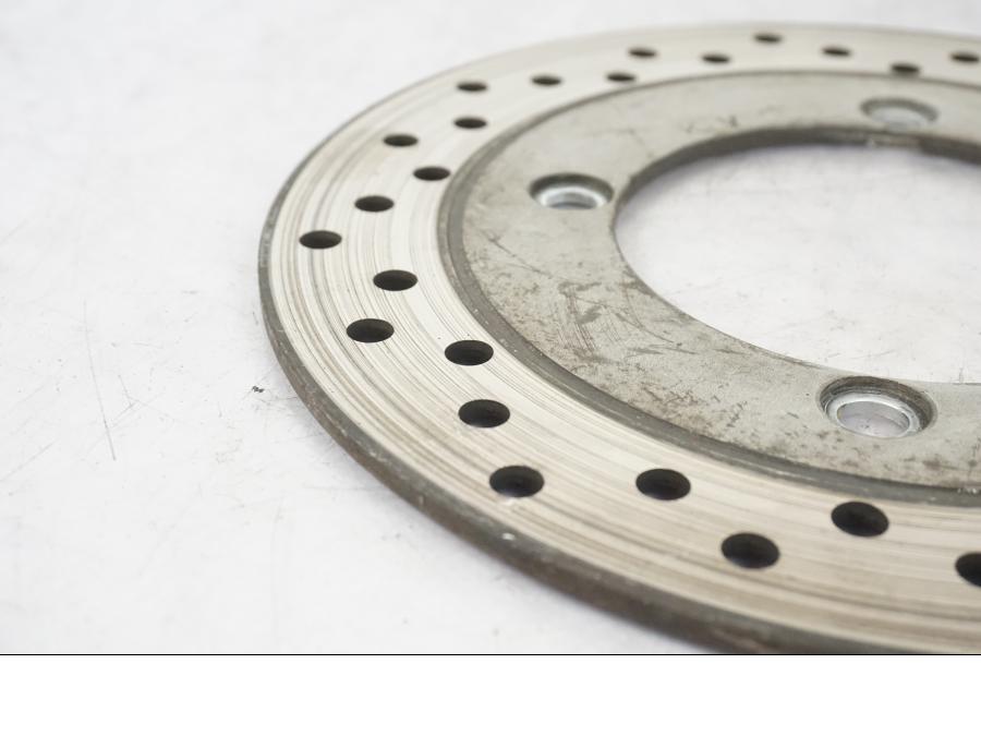 Vänster sida på Bromsskiva från en Honda CB 750 -1996 motorcykel.