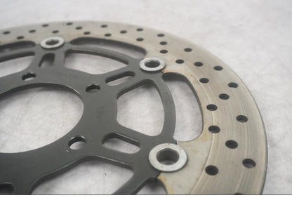 Vänster sida på Bromsskiva från en Suzuki SV 650 -2003 motorcykel.