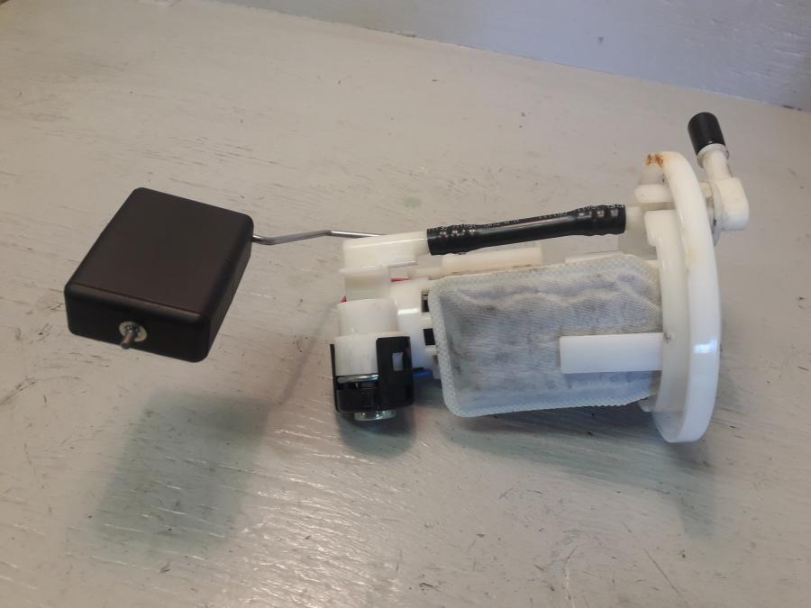 Framsidan på Bensinpump insprut från en Yamaha WR 125 -2010 motorcykel.