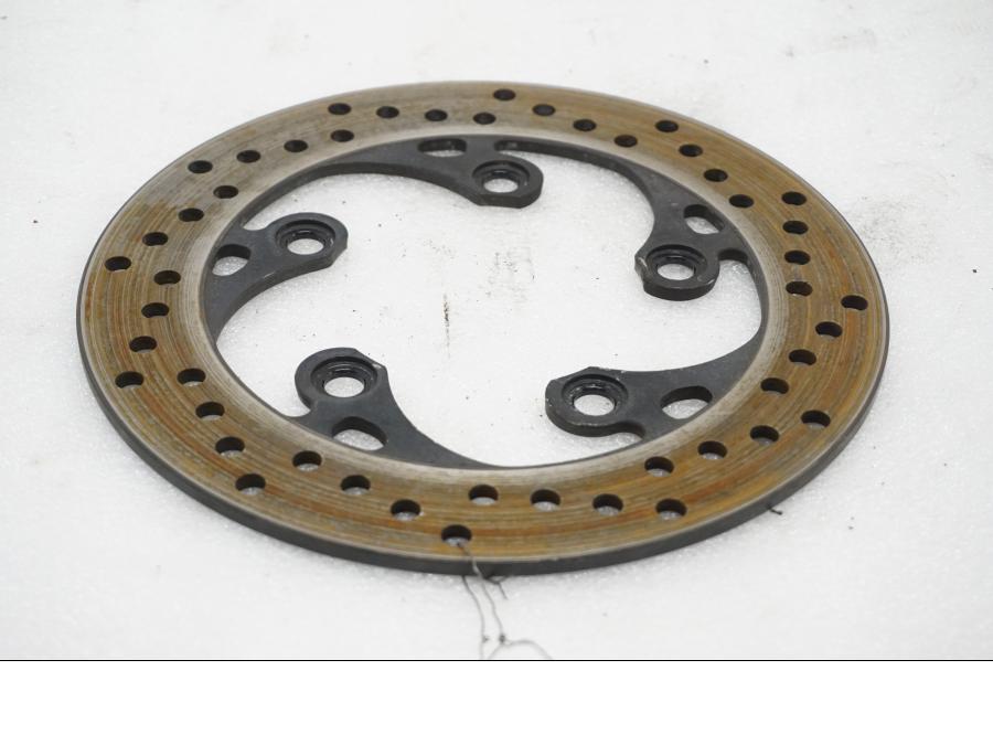 Framsidan på Bromsskiva från en Suzuki SV 1000 -2007 motorcykel.