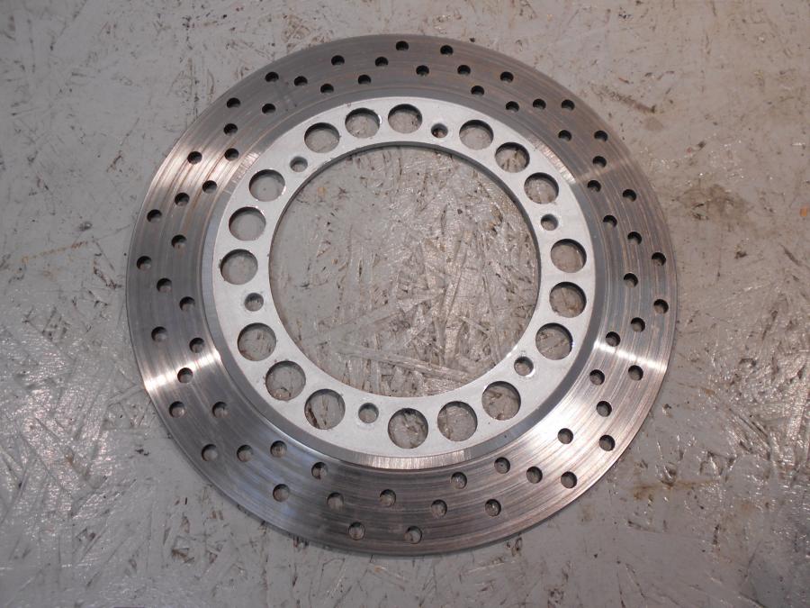 Framsidan på Bromsskiva från en Yamaha XV 1100 -1996 motorcykel.