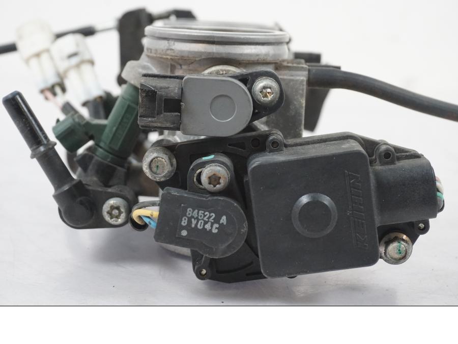 Baksidan på Spjällhus från en Kawasaki ER-6F -2010 motorcykel.