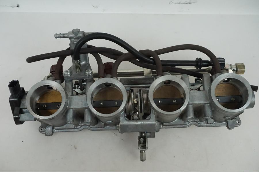 Vänster sida på Spjällhus från en Honda CBR 1000 -2005 motorcykel.