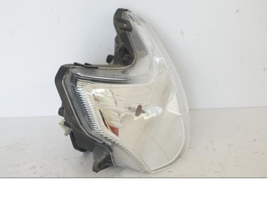 Höger sida på Strålkastare från en Honda SH 300 A -2011 scooter.