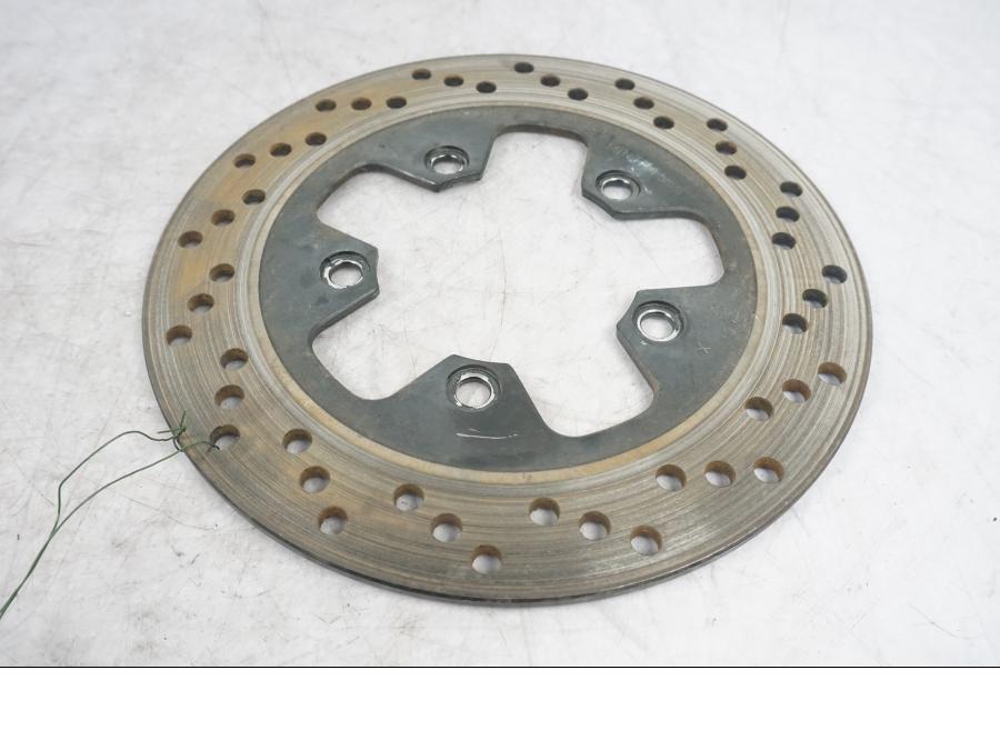 Framsidan på Bromsskiva från en Suzuki SV 650 -1999 motorcykel.