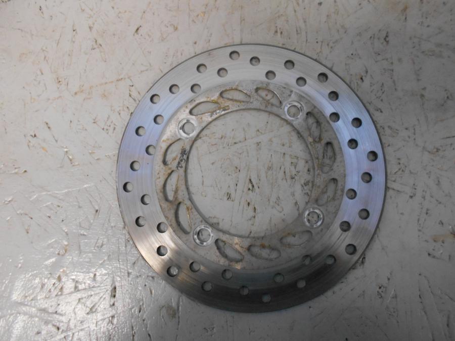 Framsidan på Bromsskiva från en Honda CBR 125 R -2006 motorcykel.