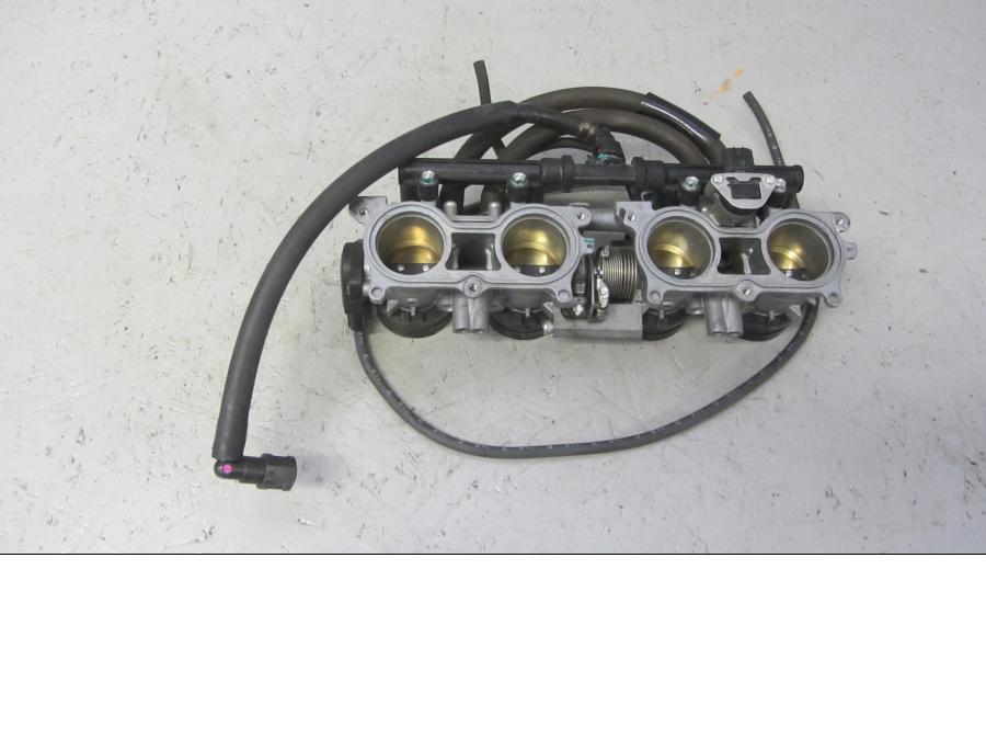 Framsidan på Spjällhus från en Honda CB 1000 R -2010 motorcykel.