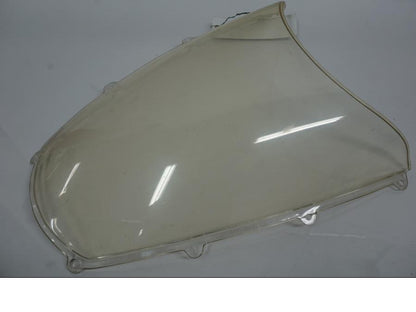 Extrabild1 på <p>Vindruta till Aprilia RSV 1000 2002.</p>

<p>Vindrutan är solblekt och har en gul "toning" sen vanlig transparant färg beroende på från vilken vinkel man kollar på den.</p>

<p>Ytliga repor / repor finns se bilder.</p> motorcykel.