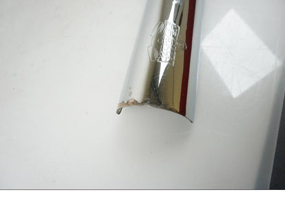 Baksidan på Värmeskydd från en H-D Harley diverse -2001 motorcykel.