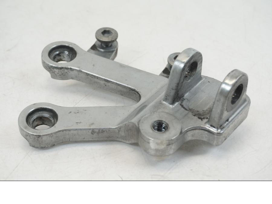 Vänster sida på Fotpinnefäste från en Kawasaki ZX-12R -2000 motorcykel.