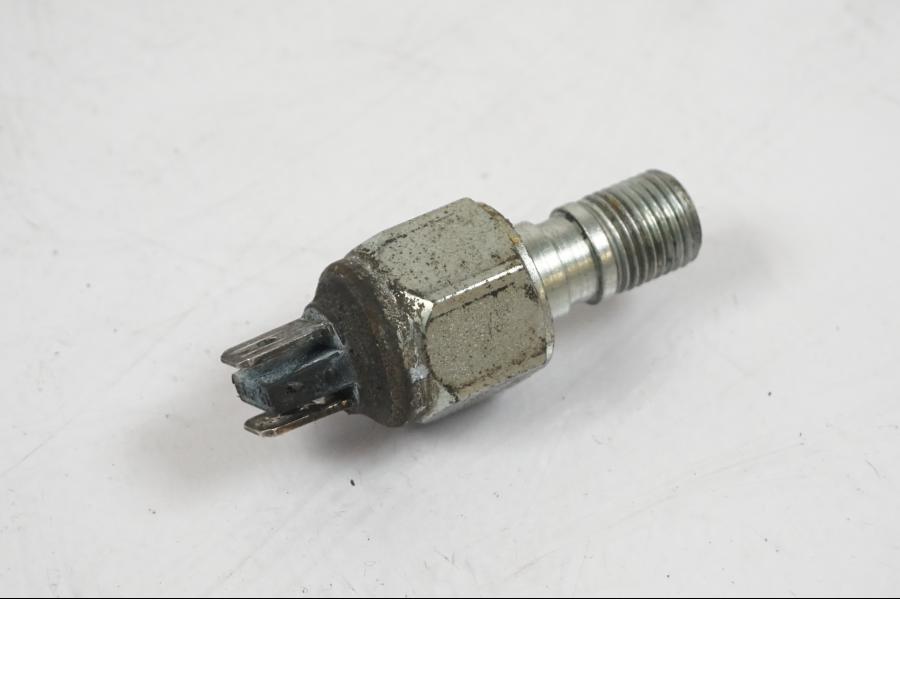 Baksidan på Bromsljuskontakt från en Aprilia RS 125 -2000 motorcykel.