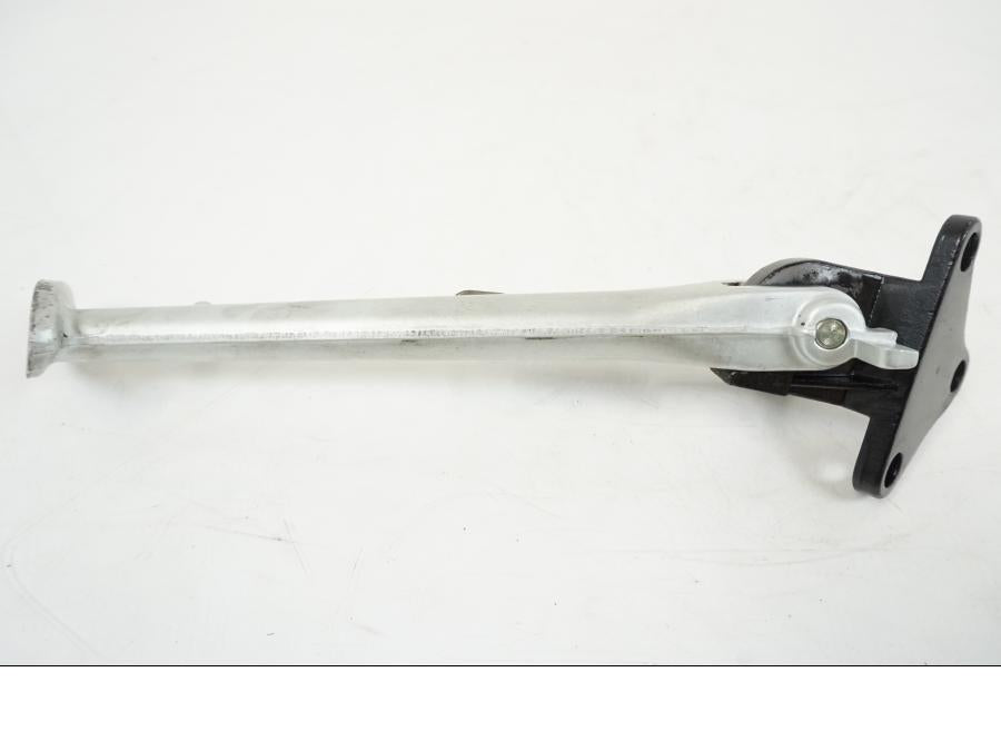 Snett uppifrån på Sidostöd från en Triumph Speed Triple -2008 motorcykel.