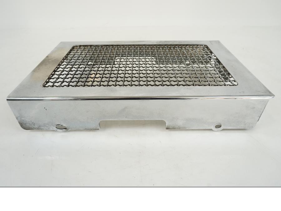 Baksidan på Oljekyldekor från en Kawasaki VN 1500 -1996 motorcykel.