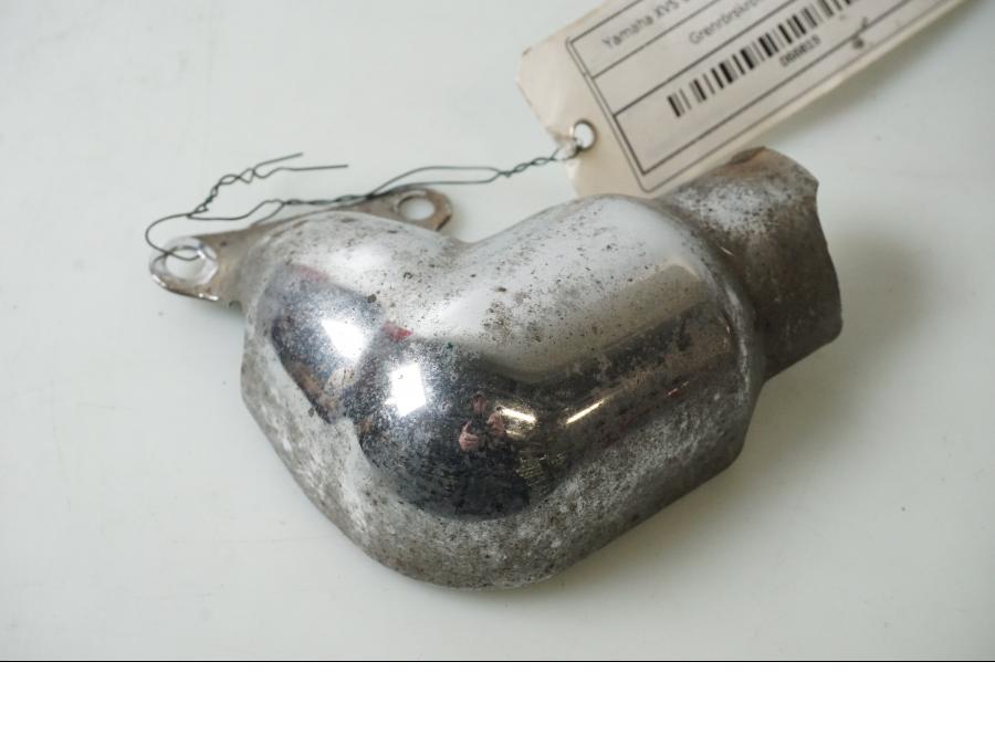 Baksidan på Värmeskydd från en Yamaha XVS 650 -1998 motorcykel.