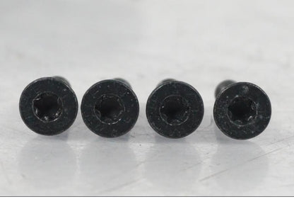 Snett nerifrån på <p>Låssats från BMW F 800 R 2010.</p>

<p>Tändningslås med antenn lite ful i ena fästet, tanklock, sadellås och 1st nyckel.</p> motorcykel.