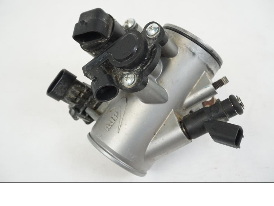 Framsidan på Spjällhus från en AJP PR7 -2021 motorcykel.